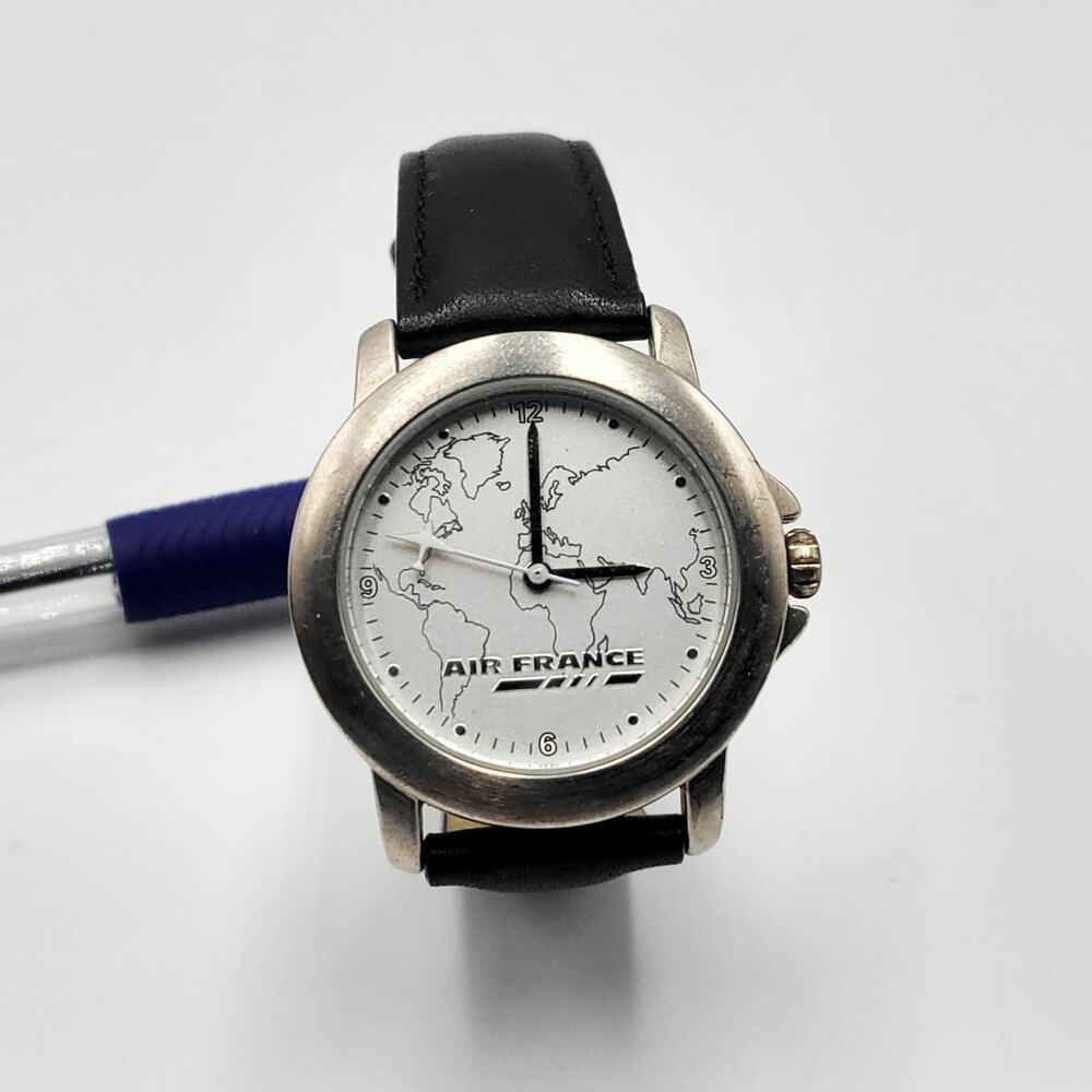 Vintage Air France Quartz Watch with a World Map Dial and Airplane Shaped Hand